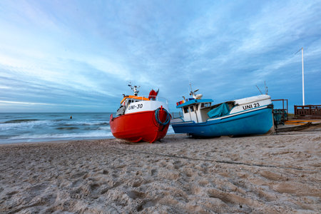 Uniescie, West Pomeranian Voivodeship Poland - December, 26, 2020: Fishing boats on the seashore. A small fishing port in Central Europe. Autumn season.のeditorial素材