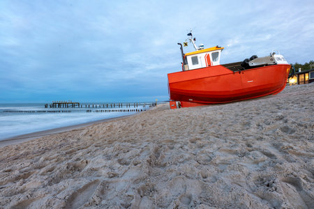 Uniescie, West Pomeranian Voivodeship Poland - December, 26, 2020: Fishing boats on the seashore. A small fishing port in Central Europe. Autumn season.のeditorial素材