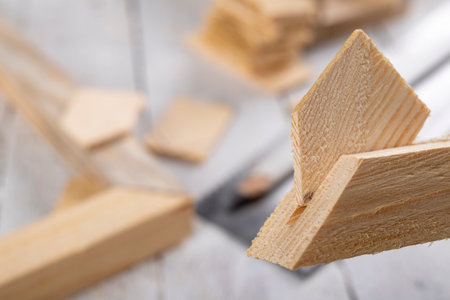 Angular connection of two pieces of wood. Making a wooden frame for a painting. Workplace carpentry workshop.の写真素材