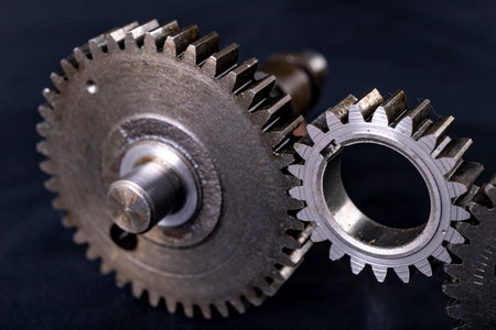 Metal gears. Accessories and spare parts for industrial machinery. Dark background.の写真素材