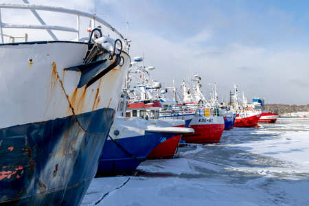 Kolobrzeg, Pomeranian Voivodeship Poland - February, 12, 2021: Fishing port covered with snow. A small fishing harbor in a winter scenery. Winter season.のeditorial素材