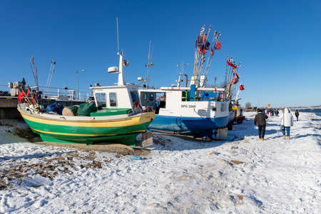 Mechelinki, Pomorskie Poland - February, 14, 2021: Fishing boats standing on the seashore. A fishing...