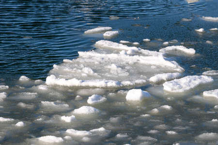 Floe floating on the sea. Frozen pieces of ice in the water. Winter season.の写真素材