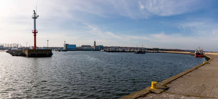 Wladyslawowo, Pomorskie Poland - February, 24, 2021: Fishing boats moored in the port. Port infrastructure in a small town in Central Europe. Season - spring.のeditorial素材