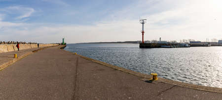 Wladyslawowo, Pomorskie Poland - February, 24, 2021: Concrete breakwater protecting the port from storm. Port infrastructure in a small town by the sea. Season - spring.のeditorial素材
