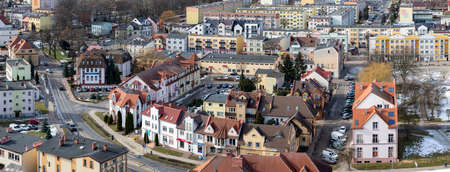 Czluchow, Pomeranian Voivodeship Poland - February, 26, 2021: Buildings of a small town - view from the tower. Residential houses in the center of a small town in Central Europe. Spring season.のeditorial素材