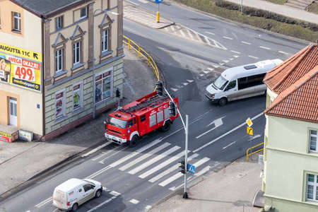 Czluchow, Pomeranian Voivodeship Poland - February, 26, 2021: Fire truck on the street of a small...