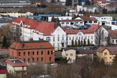 Czluchow, Pomeranian Voivodeship Poland - February, 26, 2021: Historic building of the starosty. The view from the tower on the official buildings. Spring season.のeditorial素材