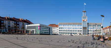 Koszalin, West Pomeranian Voivodeship Poland - March, 3, 2021: Market square and city hall building. A large square and tenement houses in the city center. Spring season.のeditorial素材