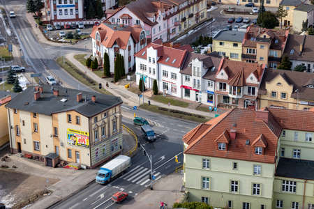 Czluchow, Pomeranian Voivodeship Poland - February, 26, 2021: A small intersection of roads with traffic lights. Traffic in a small town. Spring season.のeditorial素材