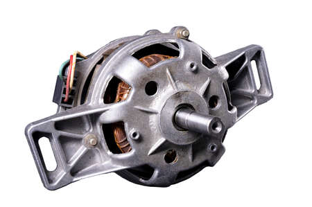 The electric motor from the washing machine. Spare parts used to repair home appliances. Isolated background.の写真素材