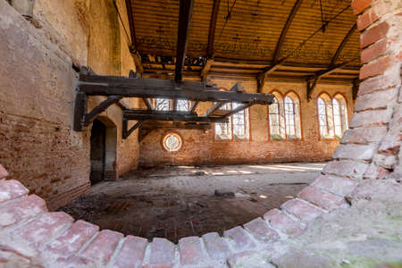 Zrazim, Kujawsko-Pomorskie Poland - April, 20, 2021: Ruined church built of red brick. An old religious site in Central Europe. Spring season.のeditorial素材