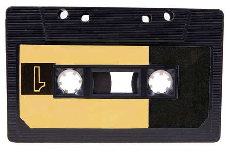 An old cassette tape with music on it. Accessories for storing music recordings. Isolated background.の写真素材