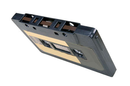 An old cassette tape with music on it. Accessories for storing music recordings. Isolated background.の写真素材