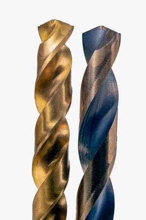 Drill bits for making holes in metal. Accessories for work in a home workshop. Isolated background.