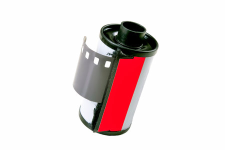 Metal roll with photosensitive film. Old black and white film for analog cameras. Isolated background.の写真素材