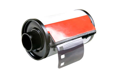 Metal roll with photosensitive film. Old black and white film for analog cameras. Isolated background.の写真素材