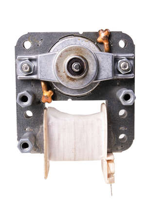 Small electric motor for the oven. Household appliance repair accessories.Isolated background.の写真素材