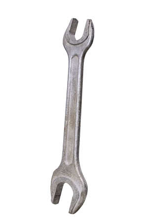 Metal open-end wrench for loosening screws. Tools for mechanics in a locksmith's workshop. Isolated background.の写真素材