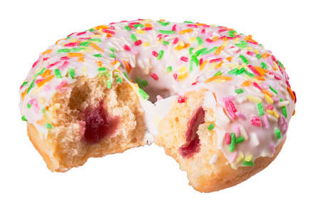 A tasty, bitten donut with frosting and colorful sprinkles. Dessert sold in cafes and pastry shops.Isolated background.の写真素材