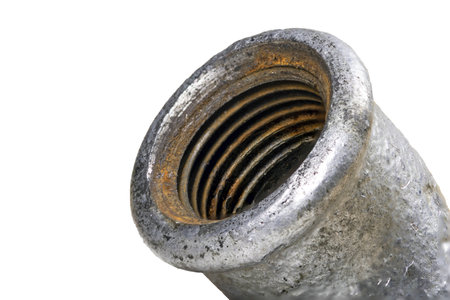 Hydraulic pipe thread. Rust covering the inside of a drinking water pipe. Isolated background.の写真素材