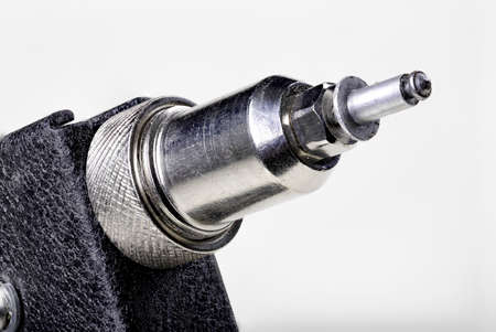 Riveter and a new rivet installed. Accessories and tools used in the locksmith's workshop. Isolated background.の写真素材