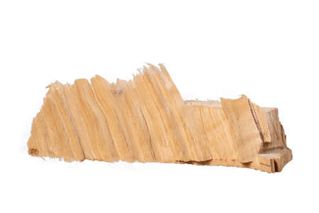 An irregular piece of pine wood. Grain texture in coniferous wood. Isolated background.の写真素材
