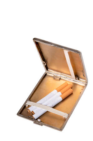 Metal cigarette case with cigarettes. A container for storing cigarettes for smoking. Isolated background.の写真素材