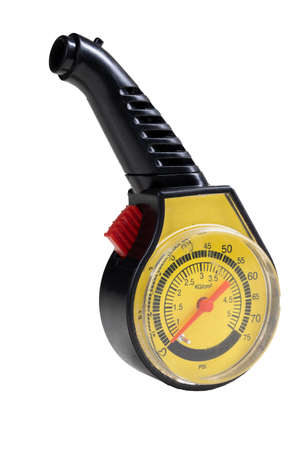 A gauge for measuring the pressure in the wheels of a car. Tools used in the car repair shop. Isolated background.の写真素材