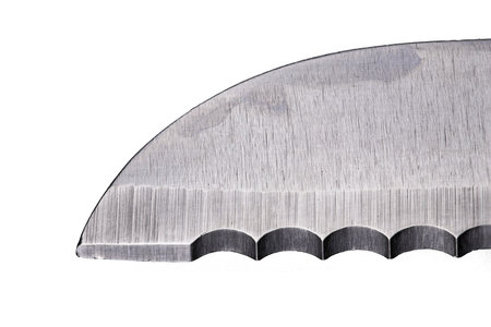 The blade of the bread knife at high magnification. Accessories used in the home kitchen. Isolated background.の写真素材