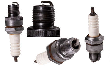 Old passenger car spark plug. Spare parts for internal combustion engines. isolated background.