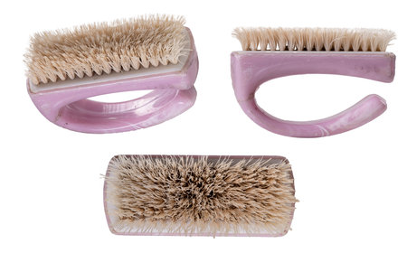Dirty hand washing brush. A simple little brush for personal hygiene. Isolated background.の写真素材