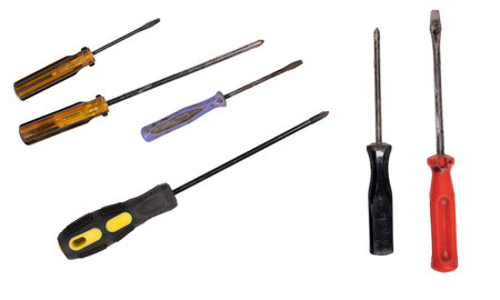 Old screwdrivers for driving and removing screws. Tools for mechanics in the workshop. Isolated...