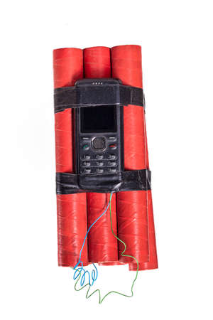 Dynamite sticks with a cell phone attached as a fuse.の写真素材