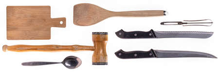 Wooden board and knife for cutting food items. Accessories used in the home kitchen.