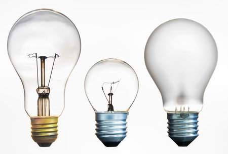 Three different filament bulbs shown on an isolated background.の写真素材