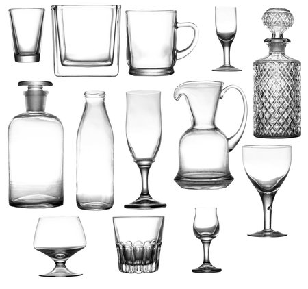 Various types of glass containers for the storage of liquids. Glasses, stemware and decanter on an isolated tele.の写真素材