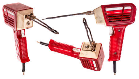 An old soldering iron used to make repairs in electronics.の写真素材