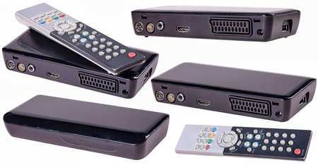 Remote control and TV set-top box for receiving terrestrial television. Isolated background.の写真素材