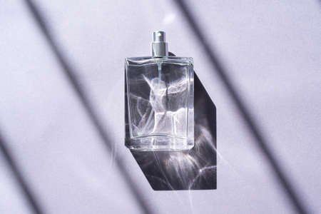 Natural light and geometric diagonal shadows. Beautiful sunshine. Clear glass without lid.