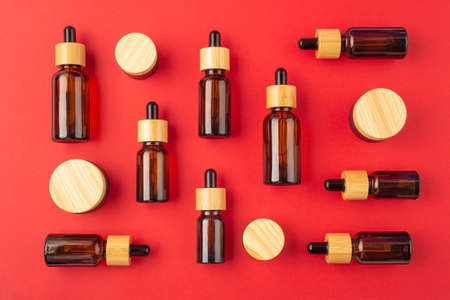 Amber glass dropper bottles different sizes with bamboo lid and jars. Zero waste concept. Top view...