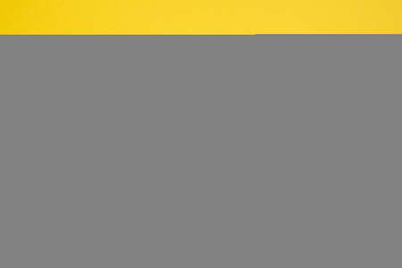 Trending concept in natural materials with plant shadow on yellow background. Presentation with daylight. Natural blurred shade. Summer sunlight from herb. Abstract beautiful backdrop for text or advertising.の写真素材