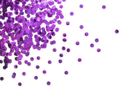 Purple round confetti on white background. Festive day backdrop. Flat lay style with minimalistic design. Template for banner or party invitationの写真素材