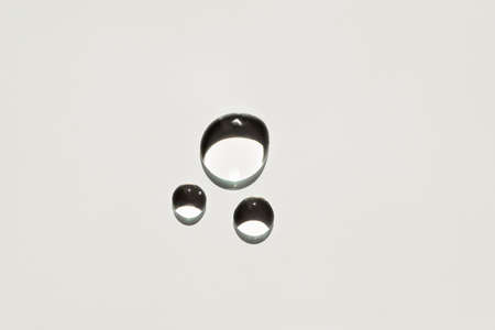 Cosmetic drops of oil or serum. Appearance of the texture of the gel on a white background. Natural skincare products. Beauty concept for face and body careの写真素材