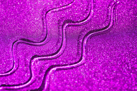 Liquid gel strips on shimmer purple paper. Natural sunshine and shadows. Skincare products. Beauty concept for face and body care. Glowing violet backgroundの写真素材