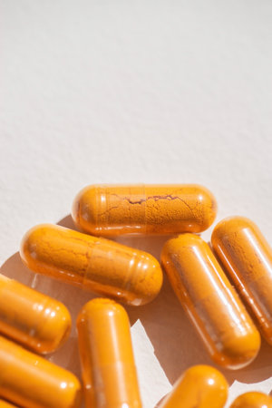 Turmeric plus black pepper extract gelatin capsule close up top view. Herbal supplement organic...