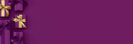 Gift boxes with purple and golden ribbon. Black Friday banner. Packaging and preparation of gifts for the celebration. Copy spaceの写真素材