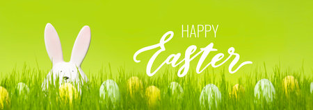 Bunch of eggs with dots on green background. Cute decor on a meadow. Greeting card with wishes....