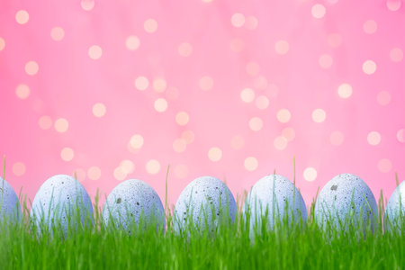 Bunch of lilac eggs with dots on pink background. Easter concept with space for text. Template for...