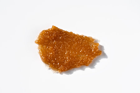 Sugar coffee body scrub texture on white background. Cosmetic smear. Appearance of the texture of the swatch. Natural skincare products. Beauty concept for face and body care.の写真素材